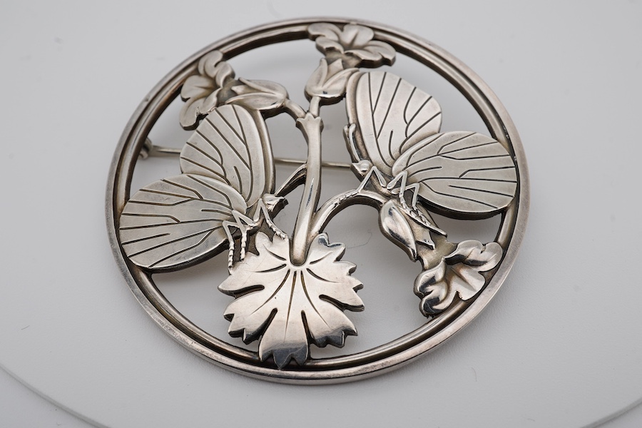 A Georg Jensen sterling moth and leaf circular brooch, design no. 283, 55mm, with Georg Jensen box. Condition - fair to good